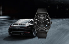Laden Sie das Bild in den Galerie-Viewer, Porsche Design | 6023.4.02.005.07.2 | Novelty 1919 Globetimer UTC | All Black-Black | Automatik | COSC Chronometer | GMT | Datumsanzeige | Titan | Saphirglas | Swiss Made | NEU OVP | mit Box &amp; Papieren | COSC-Zertifikat | 2 Jahre Hersteller-Garantie